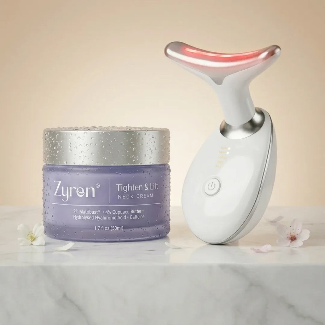Zyren Neck Lift System: Tighten & Lift Neck Cream 50ml jar next to the white LED neck sculptor on marble
